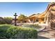 This backyard boasts a refreshing pool with a fountain, surrounded by manicured greenery and a spacious patio for relaxation at 723 W Canary Way, Chandler, AZ 85286