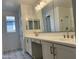 Bathroom with double vanity, quartz countertops and modern fixtures at 7654 W Tether Trl, Peoria, AZ 85383