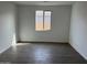 A light-filled room features warm-toned flooring, white walls, and natural light from the window at 7654 W Tether Trl, Peoria, AZ 85383