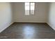 Neutral bedroom showcasing tile floors, ample natural light, and fresh paint at 7654 W Tether Trl, Peoria, AZ 85383