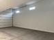 Attached garage featuring bright interiors, smooth flooring and natural light from clerestory windows at 7654 W Tether Trl, Peoria, AZ 85383