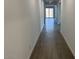 Bright hallway with neutral walls and tile flooring leading to the main living areas at 7654 W Tether Trl, Peoria, AZ 85383