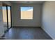 This living room features modern styling with light paint and a large window at 7654 W Tether Trl, Peoria, AZ 85383