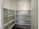 Walk-in pantry with adjustable shelving for ample food and supply storage at 7654 W Tether Trl, Peoria, AZ 85383