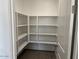 A walk-in pantry with white shelves offering ample storage space at 7654 W Tether Trl, Peoria, AZ 85383