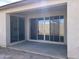 Covered patio area with access to the home through sliding glass doors at 7654 W Tether Trl, Peoria, AZ 85383