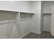 Empty walk-in closet with metal racks and shelving at 7654 W Tether Trl, Peoria, AZ 85383