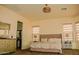 Bedroom with a double bed, matching side tables and lamps and an ensuite bathroom at 9405 S 47Th Ave, Laveen, AZ 85339