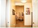 Hallway view leading to a dining area, complemented by stylish decor and neutral colors at 9405 S 47Th Ave, Laveen, AZ 85339