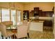 Charming kitchen and breakfast nook featuring stylish chairs and sliding glass door at 9405 S 47Th Ave, Laveen, AZ 85339