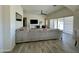 Spacious living room featuring vaulted ceilings, tile flooring, a large sectional, and natural light at 9405 S 47Th Ave, Laveen, AZ 85339