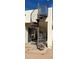 Outdoor spiral staircase offering access to a rooftop patio in the side yard at 9405 S 47Th Ave, Laveen, AZ 85339