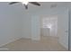 Neutral bedroom with two doors, carpeting, and a ceiling fan at 9556 W Frank Ave, Peoria, AZ 85382