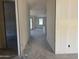 Spacious hallway leading to multiple rooms ready for you to make it your own at 9618 W Parkway Dr, Tolleson, AZ 85353