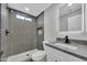 Modern bathroom featuring walk-in shower with a square shower head and a vanity with a sink at 10013 N 56Th Dr, Glendale, AZ 85302