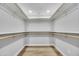 Walk-in closet featuring ample storage and a well-lit interior with shelves and rods at 10013 N 56Th Dr, Glendale, AZ 85302