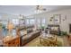 Bright living room showcasing an open floor plan, neutral walls, and access to the dining area at 10145 W Devonshire Dr, Arizona City, AZ 85123