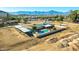 Expansive property featuring a sparkling pool, horse enclosures and mountain views at 10212 S 47Th Ave, Laveen, AZ 85339