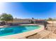 Backyard pool with steps leading into the water, surrounded by desert landscaping at 10212 S 47Th Ave, Laveen, AZ 85339