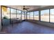 Enclosed sunroom with a tile floor and surrounded by large windows at 10212 S 47Th Ave, Laveen, AZ 85339