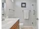 Well-lit bathroom featuring a vanity with storage and a glass-enclosed shower at 10280 N 109Th Ave, Sun City, AZ 85351