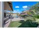 Inviting backyard features a pool, patio, and lush landscaping, creating a private oasis for relaxation and enjoyment at 104 W Windsong Dr, Phoenix, AZ 85045