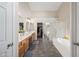 Elegant bathroom featuring a soaking tub, a glass-enclosed shower, and double vanities, creating a luxurious and spa-like experience at 104 W Windsong Dr, Phoenix, AZ 85045