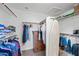 Well-organized walk-in closet with ample storage, featuring shelves, hanging rods, and a dresser, providing a tidy and functional space at 104 W Windsong Dr, Phoenix, AZ 85045