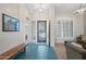 Welcoming foyer with decorative lighting, tile flooring and an open view of the living room at 104 W Windsong Dr, Phoenix, AZ 85045