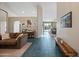 Bright entryway showcasing tile flooring, neutral walls, and an open floor plan at 104 W Windsong Dr, Phoenix, AZ 85045