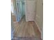 Hallway with wood flooring and access to multiple rooms at 104 W Windsong Dr, Phoenix, AZ 85045