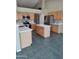 Bright kitchen featuring stainless steel appliances, a center island, and light wood cabinetry at 104 W Windsong Dr, Phoenix, AZ 85045