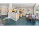 Bright kitchen with stainless appliances, ample cabinet space, and adjacent dining area at 104 W Windsong Dr, Phoenix, AZ 85045