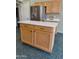 Kitchen island with white countertops and a stainless steel refrigerator at 104 W Windsong Dr, Phoenix, AZ 85045