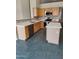 Kitchen with light wood cabinetry, white countertops, and stainless steel appliances at 104 W Windsong Dr, Phoenix, AZ 85045
