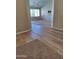 Carpeted living area with large windows for ample natural light at 104 W Windsong Dr, Phoenix, AZ 85045