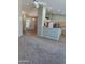 Bright living room with modern flooring, neutral walls, and open kitchen access at 104 W Windsong Dr, Phoenix, AZ 85045