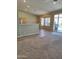 Open-concept living area boasts pool views and lots of natural light at 104 W Windsong Dr, Phoenix, AZ 85045