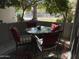 Cozy outdoor dining area with a glass table and cushioned seating at 1107 W Osborn Rd # 106, Phoenix, AZ 85013