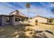 View of backyard featuring well-maintained landscaping and mature palm tree at 122 Leisure World --, Mesa, AZ 85206