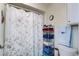 Comfortable bathroom space with floral shower curtain and ample storage at 122 Leisure World --, Mesa, AZ 85206