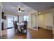 Well-lit dining room with a ceiling fan, a view of the carport, and access to the kitchen at 122 Leisure World --, Mesa, AZ 85206