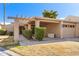 Charming home with a covered entryway, one-car garage, and well-maintained desert landscaping at 122 Leisure World --, Mesa, AZ 85206