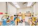 Bright work room features specialized tools, ventilation and plenty of storage space for creative projects and hobbies at 122 Leisure World --, Mesa, AZ 85206