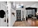 Charming entryway featuring tile flooring, board and batten accent wall, and a view into the living room at 1260 N Concord Ave, Chandler, AZ 85225