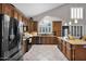 Well-lit kitchen features an island, stainless steel appliances, and wooden cabinets at 1260 N Concord Ave, Chandler, AZ 85225