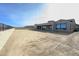Large backyard featuring a covered patio, block wall, and desert landscaping at 12870 E Rosewood Dr, Scottsdale, AZ 85255