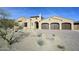 Charming single-Gathering home featuring a three-car garage and desert landscaping at 12870 E Rosewood Dr, Scottsdale, AZ 85255