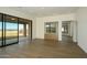 Bright living room boasting hardwood floors, sliding glass doors, and outdoor views at 12870 E Rosewood Dr, Scottsdale, AZ 85255