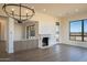 Inviting living room featuring a fireplace and an open floor plan at 12870 E Rosewood Dr, Scottsdale, AZ 85255